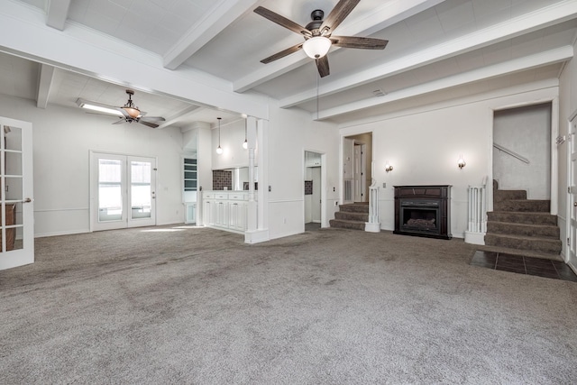 unfurnished living room with french doors, ceiling fan, beam ceiling, and dark carpet