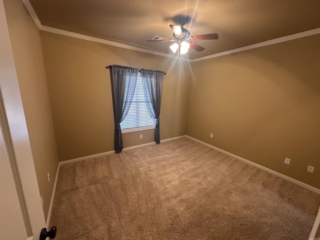 unfurnished room featuring carpet floors, ornamental molding, and ceiling fan