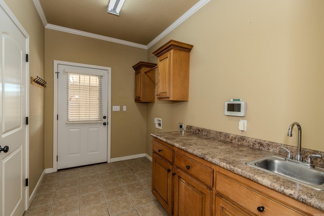 washroom with sink, cabinets, ornamental molding, washer hookup, and electric dryer hookup