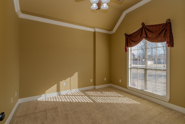 unfurnished room featuring crown molding, ceiling fan, vaulted ceiling, and carpet