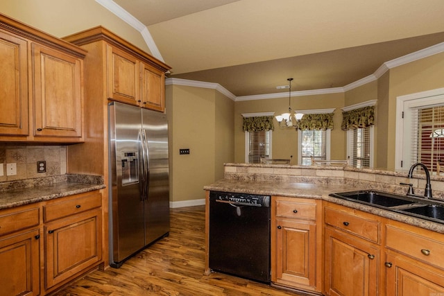 kitchen featuring sink, stainless steel fridge, black dishwasher, light hardwood / wood-style floors, and backsplash