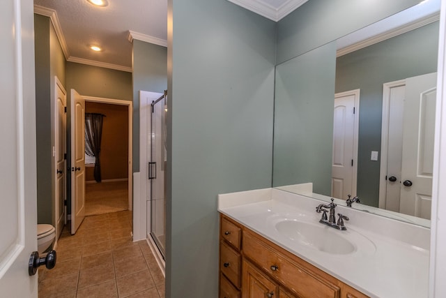 bathroom with crown molding, an enclosed shower, tile patterned floors, and vanity