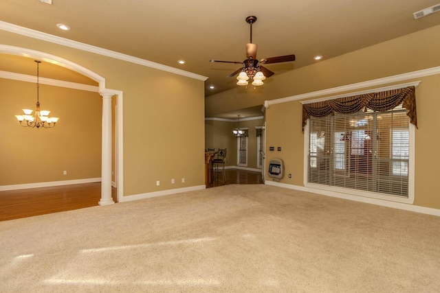 unfurnished living room featuring ceiling fan with notable chandelier, ornamental molding, carpet flooring, and decorative columns