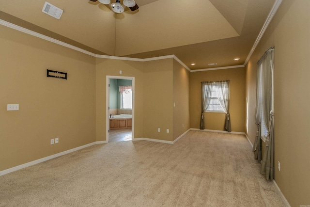 unfurnished room with ornamental molding, light colored carpet, and ceiling fan