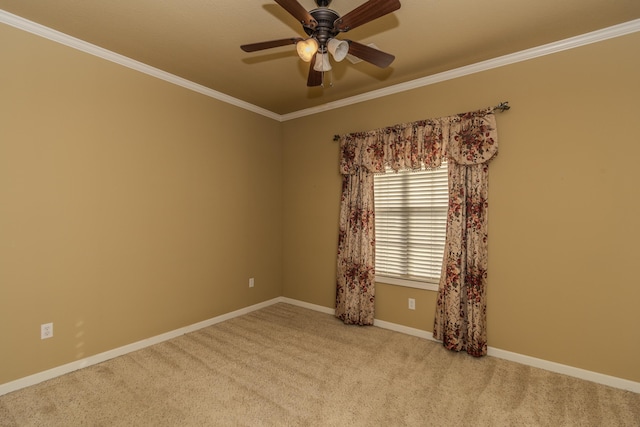 carpeted empty room with crown molding and ceiling fan