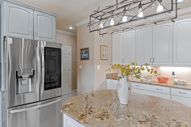 kitchen featuring white cabinets and stainless steel fridge with ice dispenser