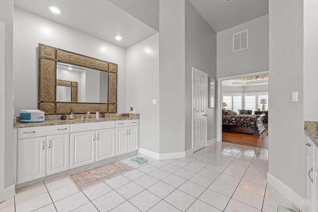 bathroom featuring tile patterned floors and vanity