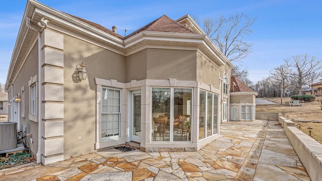 exterior space featuring central AC and a patio area