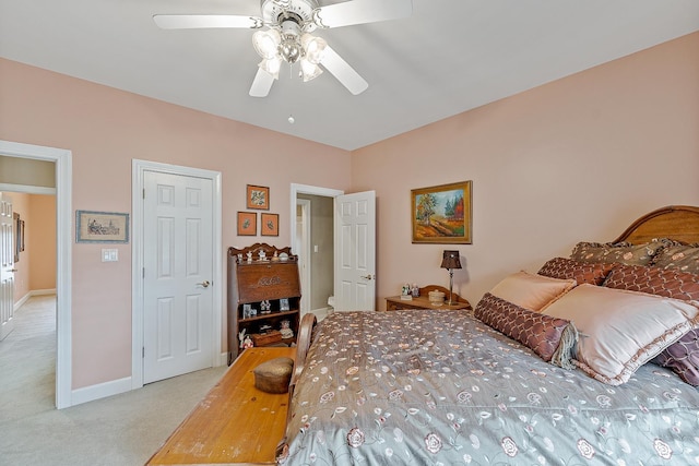 bedroom with ceiling fan and light colored carpet