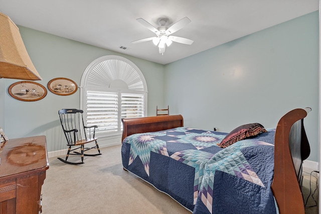 bedroom with ceiling fan and carpet