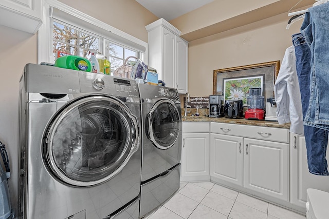 clothes washing area featuring cabinets, light tile patterned floors, separate washer and dryer, and sink