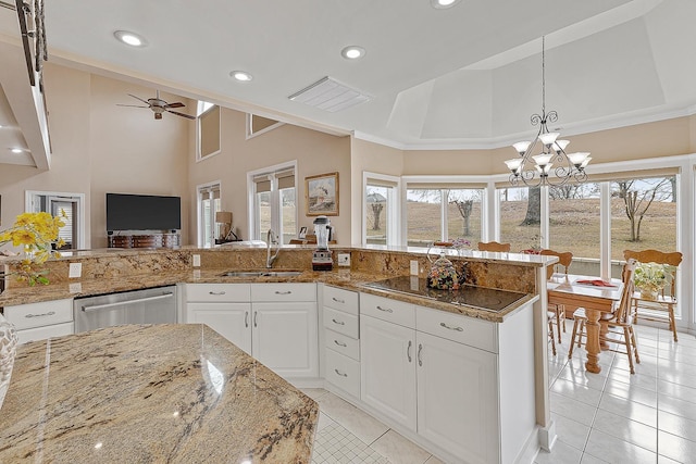 kitchen featuring sink, white cabinetry, dishwasher, and a towering ceiling