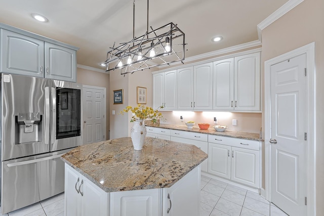 kitchen with stainless steel fridge with ice dispenser, crown molding, white cabinets, and a center island