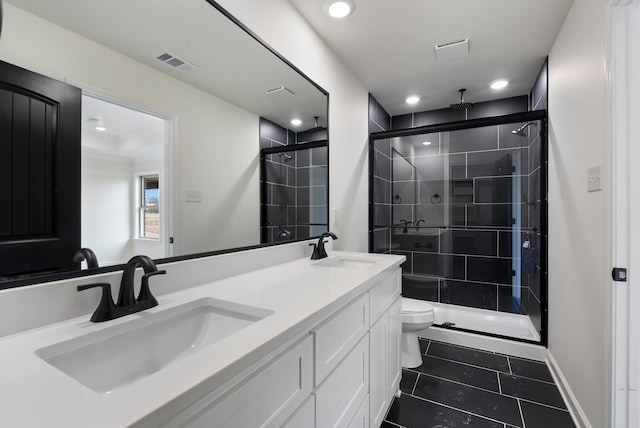 bathroom with a shower with shower door, tile patterned floors, toilet, and vanity