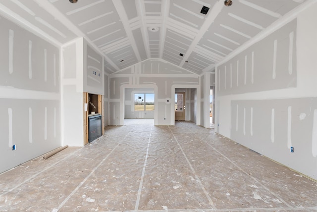 unfurnished living room with lofted ceiling