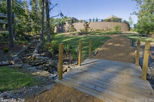 view of home's community with a yard and a wooden deck