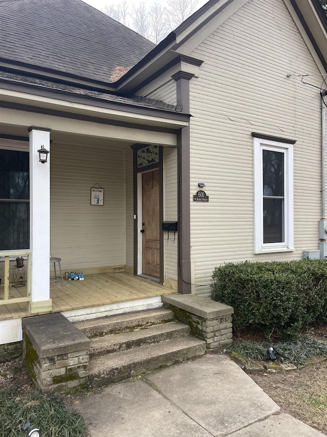 entrance to property featuring a porch