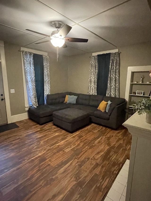 living room with ceiling fan and hardwood / wood-style flooring