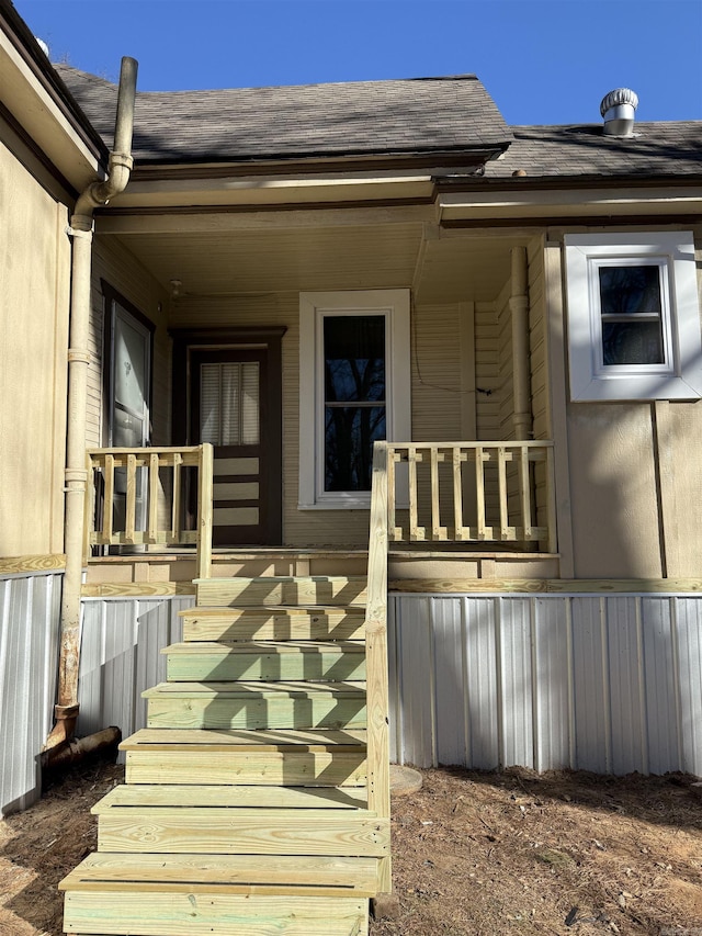 doorway to property featuring covered porch