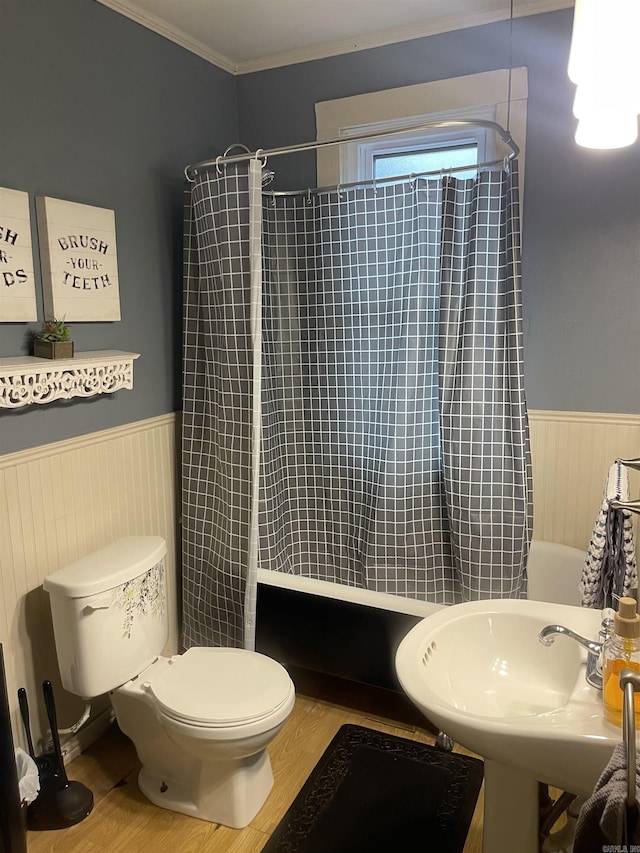 bathroom featuring hardwood / wood-style flooring, sink, toilet, and crown molding