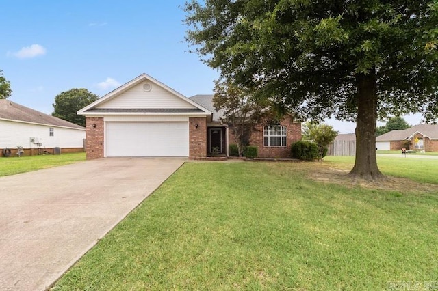 ranch-style house featuring a garage and a front yard