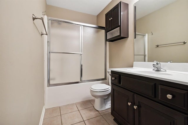 full bathroom with toilet, bath / shower combo with glass door, tile patterned floors, and vanity