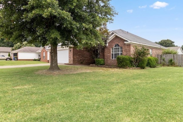 single story home featuring a front lawn and a garage