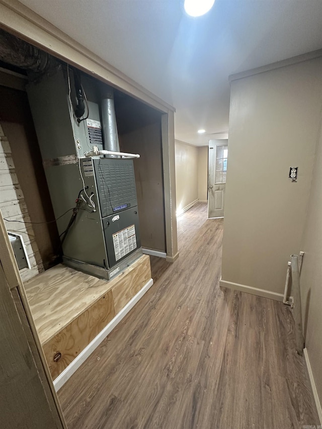 corridor featuring hardwood / wood-style floors