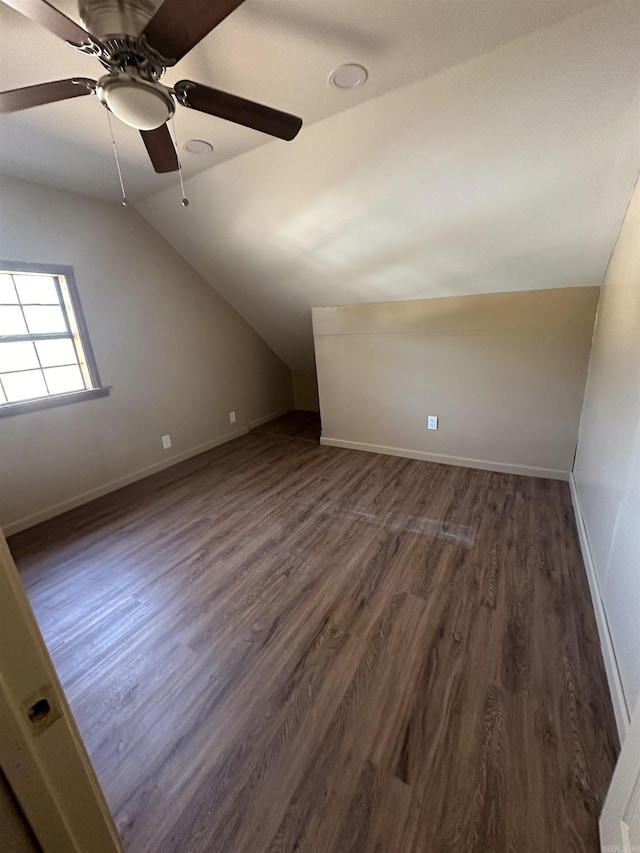 bonus room featuring vaulted ceiling, ceiling fan, and dark hardwood / wood-style flooring