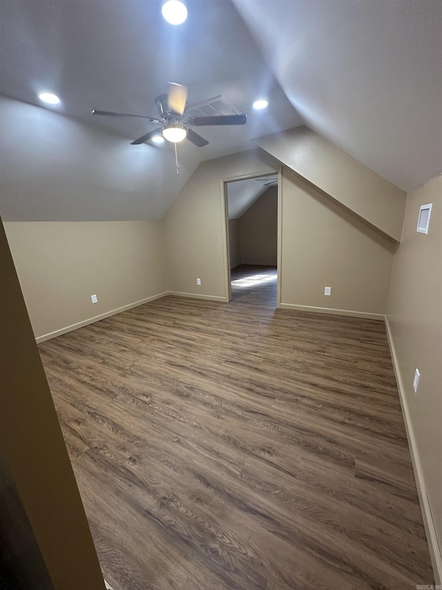 bonus room with ceiling fan, dark hardwood / wood-style floors, and vaulted ceiling