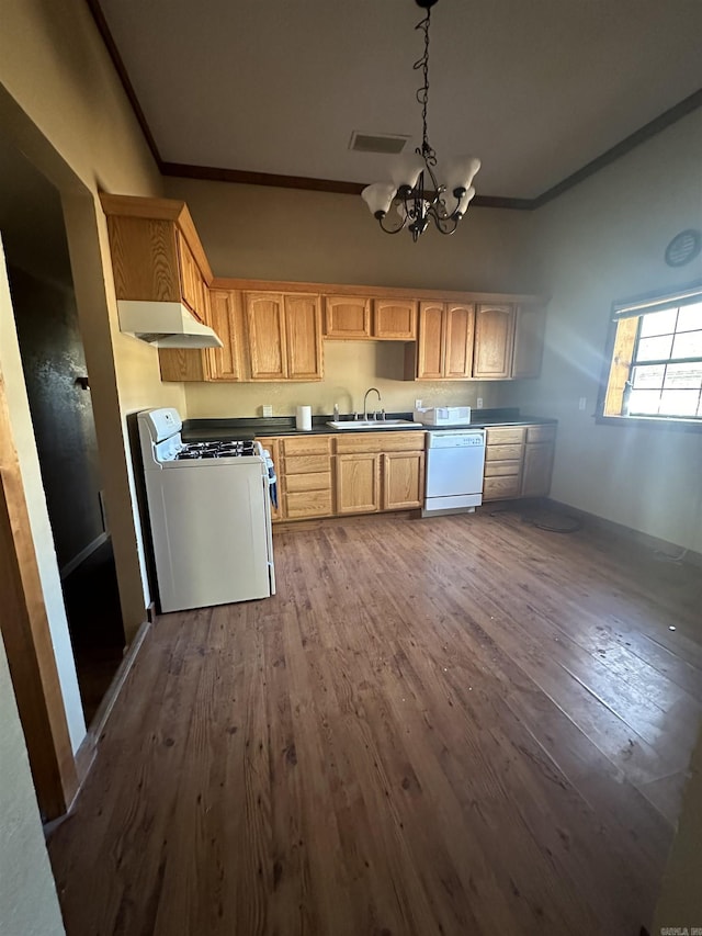 kitchen with white appliances, light brown cabinetry, sink, dark hardwood / wood-style floors, and a notable chandelier