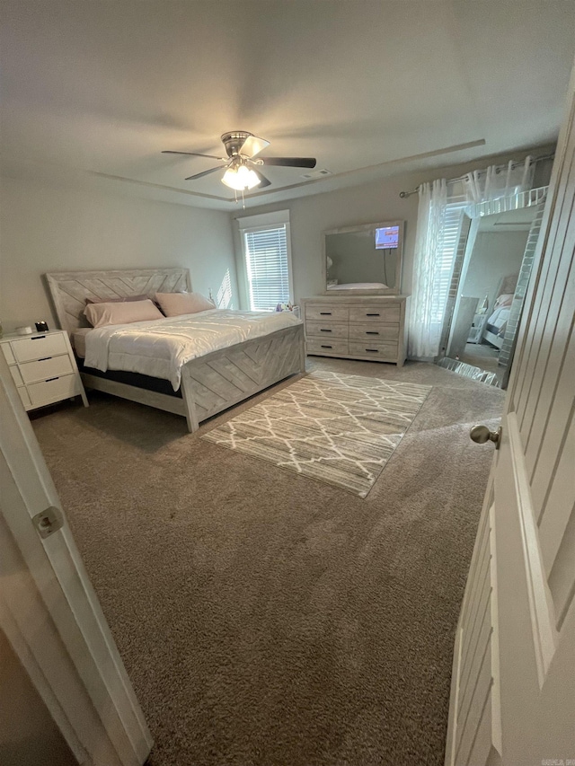 unfurnished bedroom featuring carpet and ceiling fan