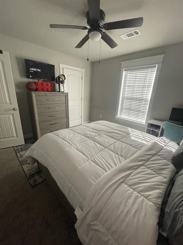 bedroom featuring a closet, ceiling fan, and carpet flooring