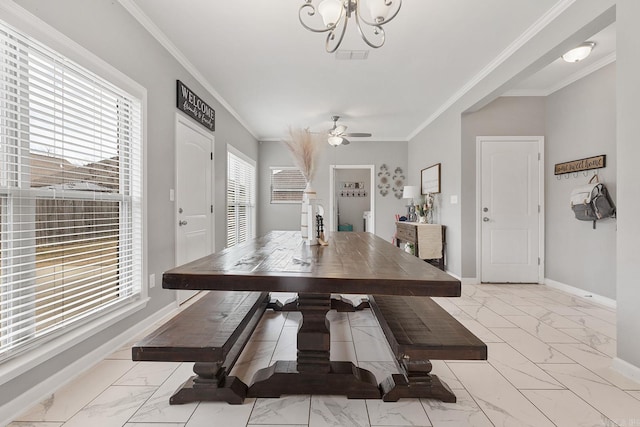 dining space featuring crown molding, a healthy amount of sunlight, and ceiling fan with notable chandelier