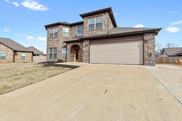 view of front of home with a front lawn and a garage