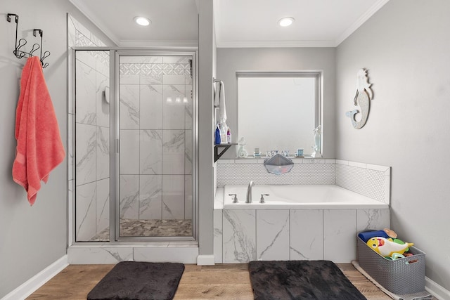 bathroom with independent shower and bath, ornamental molding, and wood-type flooring