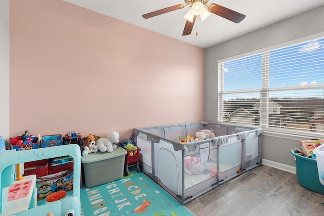 bedroom featuring ceiling fan and wood-type flooring