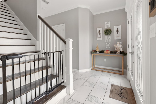 entryway featuring ornamental molding