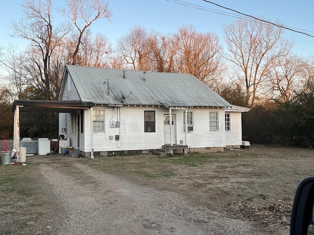 view of front of property with a carport