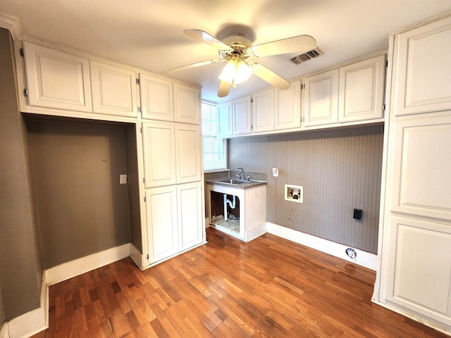 clothes washing area featuring cabinets, dark hardwood / wood-style flooring, sink, hookup for a washing machine, and ceiling fan