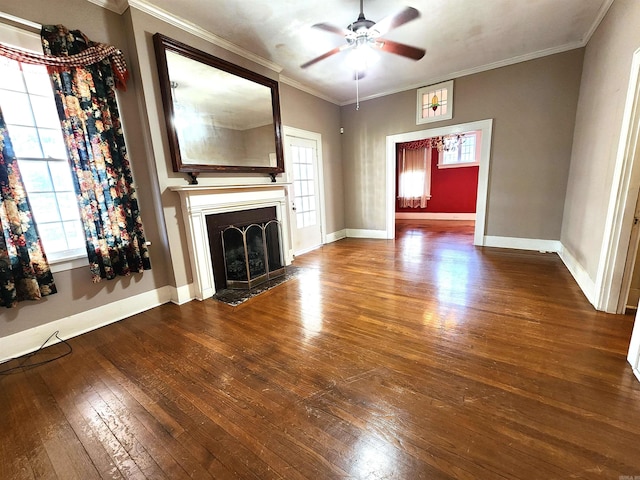 unfurnished living room with ceiling fan, wood-type flooring, and crown molding