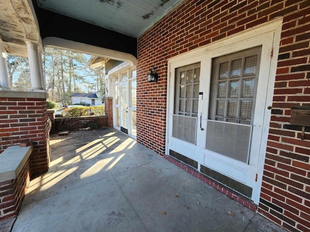 view of patio / terrace with covered porch and french doors