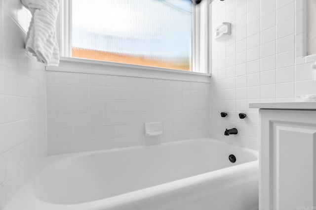 bathroom featuring a tub and vanity