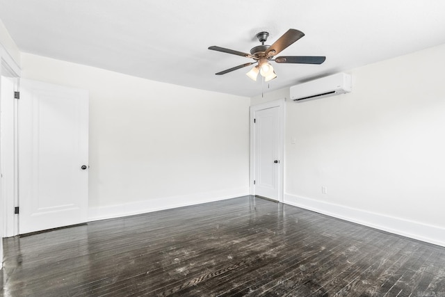 empty room with ceiling fan, dark hardwood / wood-style floors, and a wall mounted air conditioner