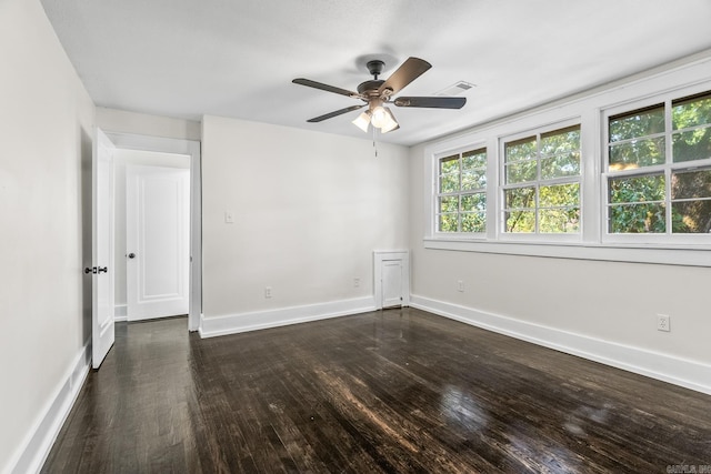 spare room with ceiling fan and dark hardwood / wood-style floors