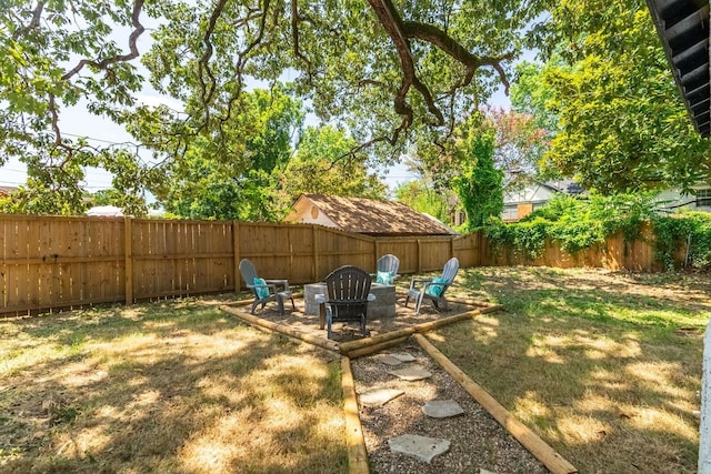 view of yard with a fire pit and a patio