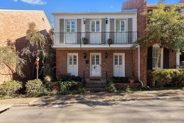 view of front of home with a balcony