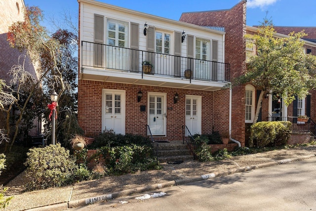 view of front of property with a balcony