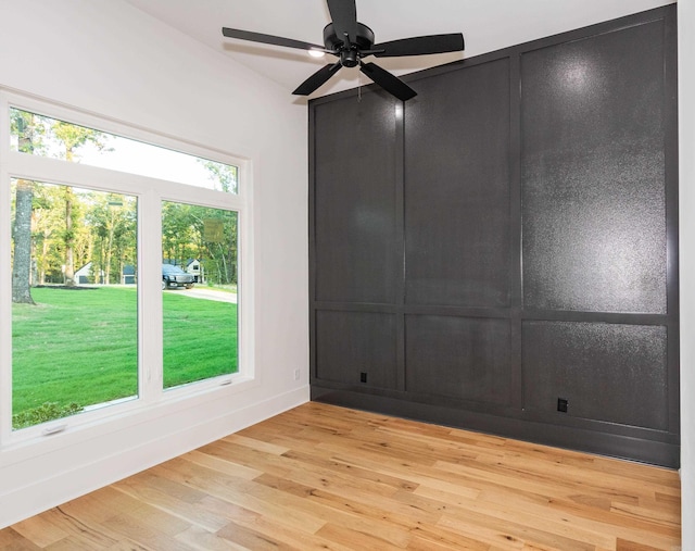 unfurnished room with ceiling fan and light wood-type flooring