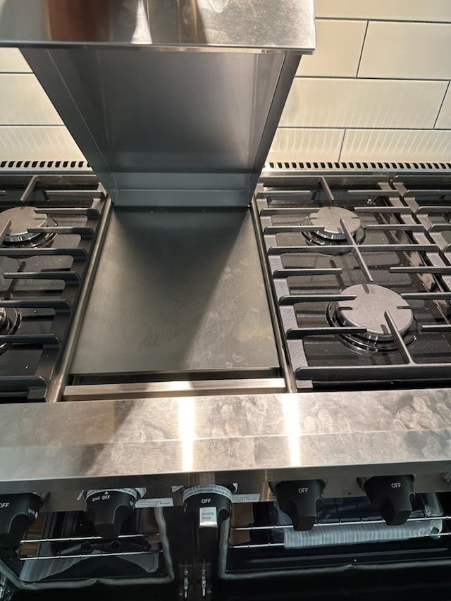 details featuring range with gas stovetop